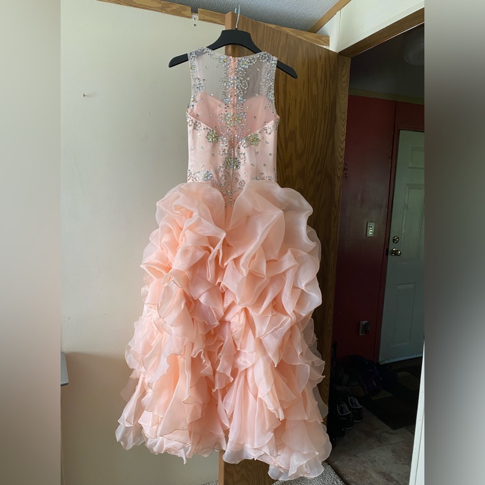 Fits a size 0-2, has beading detail on the front and back